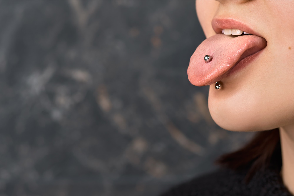 woman with a tongue piercing close-up