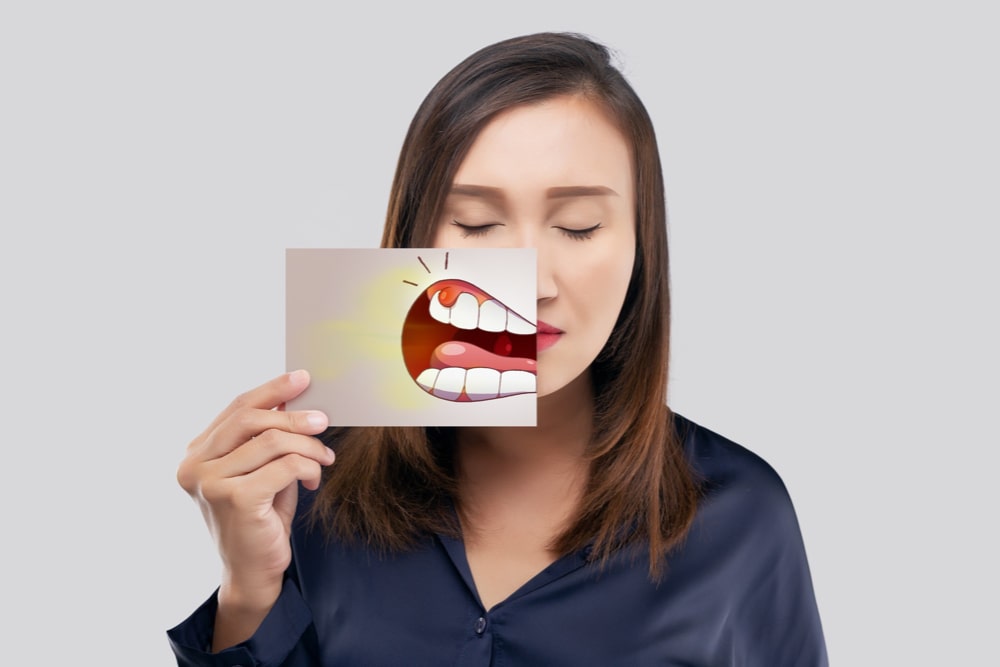 woman with a drawing of gum disease