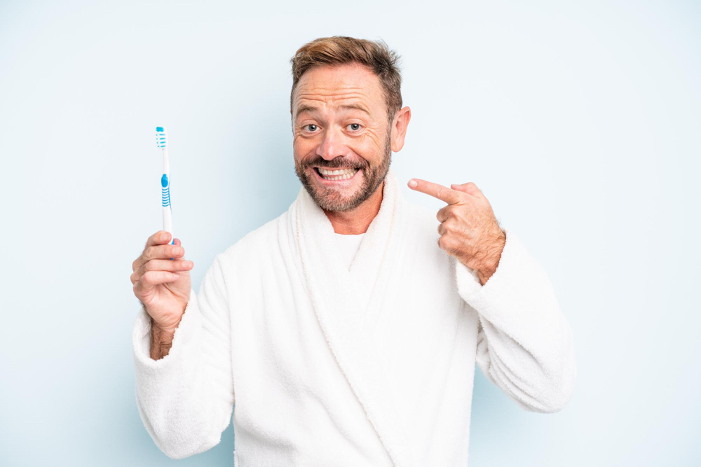 Man holding toothbrush