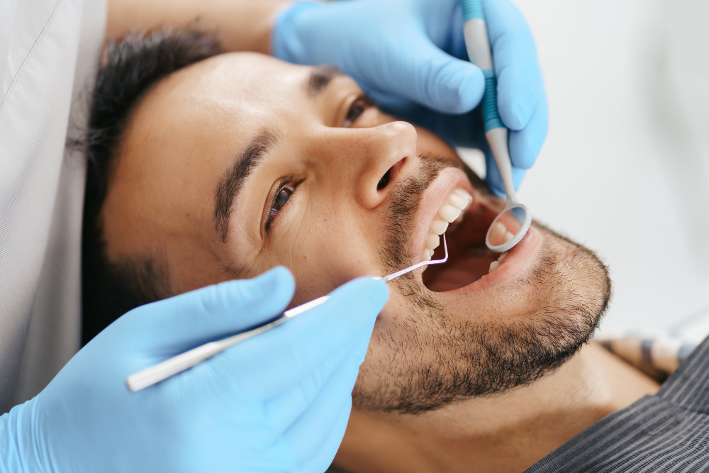 man getting his teeth examined at the dentist on south shore at Boucherville